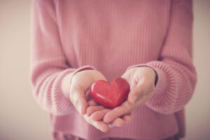 holding a heart shaped item